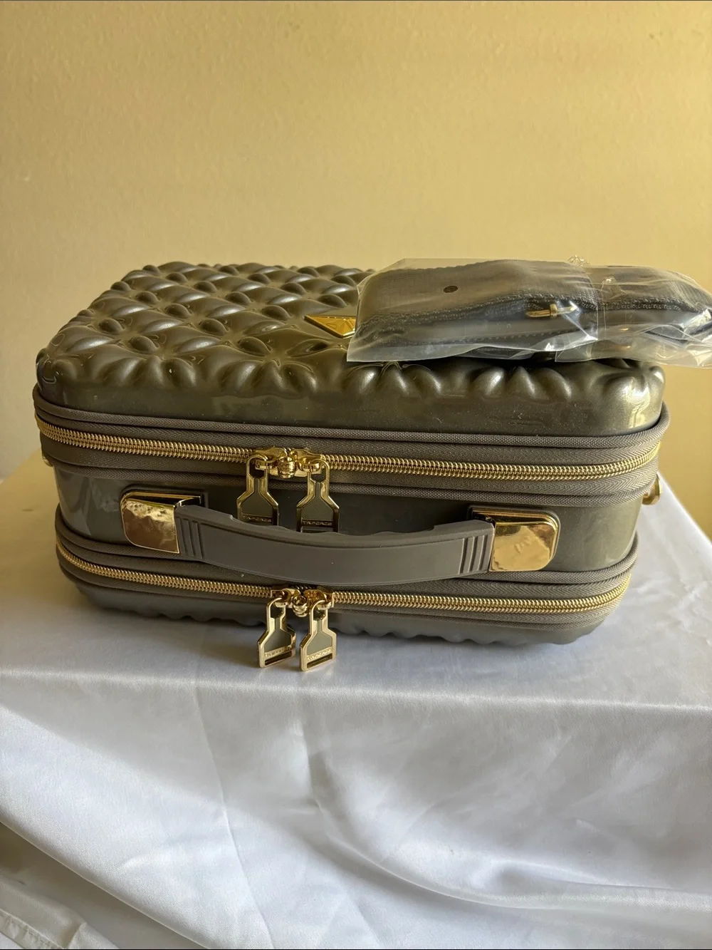 Metallic Gray Quilted Cosmetic Case with Gold Accents